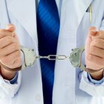 Close Up of Doctor in Handcuffs